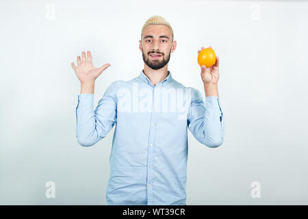 man with blond hair, black beard over isolated white background shows emotions Stock Photo