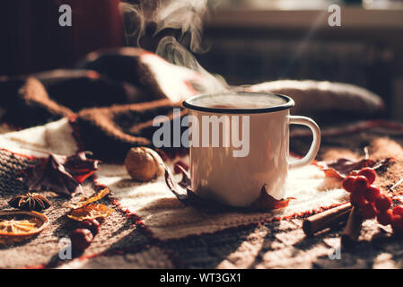 Autumn hot steaming cup of coffee or tea. Stock Photo