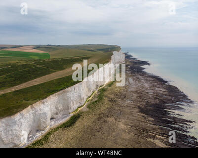 The Seven Sisters chalk cliffs by the English Channel. They form part of the South Downs in East Sussex, between the towns of Seaford  Eastbourne Stock Photo