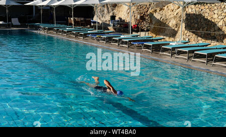 The first swimmer of the day in a hotel swimming pool Stock Photo - Alamy