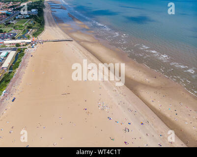 Aerial photo of the British seaside town of Skegness in the East Lindsey a district of Lincolnshire, England, showing the beach and pier on a beautifu Stock Photo