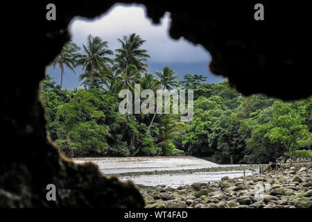 Natural window with view on beach and rainforest, Cape Tribulation National Park, Queensland, Australia Stock Photo