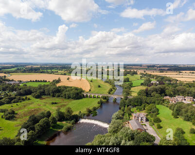 Aerial photo of the the historic Tadcaster Viaduct and River Wharfe located in the West Yorkshire British town of Tadcaster, taken on a bright sunny d Stock Photo