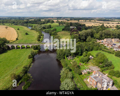 Aerial photo of the the historic Tadcaster Viaduct and River Wharfe located in the West Yorkshire British town of Tadcaster, taken on a bright sunny d