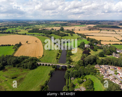 Aerial photo of the the historic Tadcaster Viaduct and River Wharfe located in the West Yorkshire British town of Tadcaster, taken on a bright sunny d Stock Photo