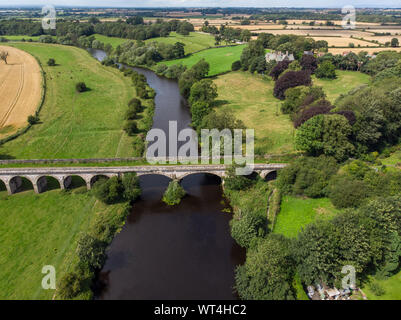 Aerial photo of the the historic Tadcaster Viaduct and River Wharfe located in the West Yorkshire British town of Tadcaster, taken on a bright sunny d Stock Photo