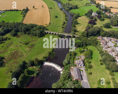 Aerial photo of the the historic Tadcaster Viaduct and River Wharfe located in the West Yorkshire British town of Tadcaster, taken on a bright sunny d Stock Photo