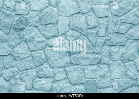 Cobblestones wall, gray background. Light blue texture of stone wall. Masonry rough surface, modern design. Grey bricks, natural pattern. Abstract arc Stock Photo