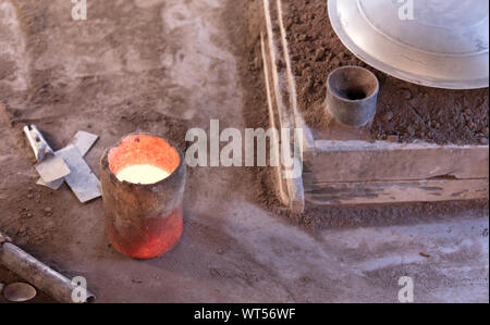 Manufacturing of aluminum kitchen utensils, working with salvaged materials, selective focus Stock Photo