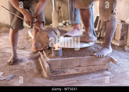 Manufacturing of aluminum kitchen utensils, working with salvaged materials, selective focus Stock Photo