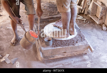 Manufacturing of aluminum kitchen utensils, working with salvaged materials, selective focus Stock Photo