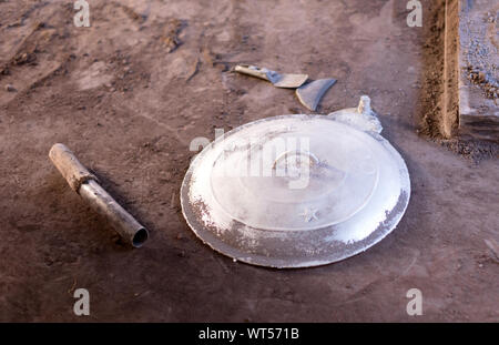 Manufacturing of aluminum kitchen utensils, working with salvaged materials, selective focus Stock Photo