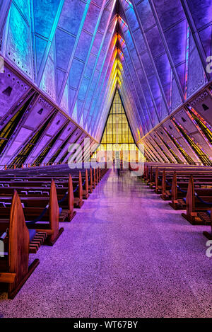 Stain Glass windows coloring the inside of the Protestant Chapel at the  US Air Force Academy, Stock Photo