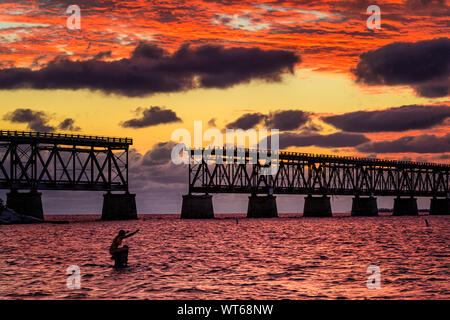 Swimming at dusk off Calusa Beach in Bahia Honda State Park, lower Keys Stock Photo