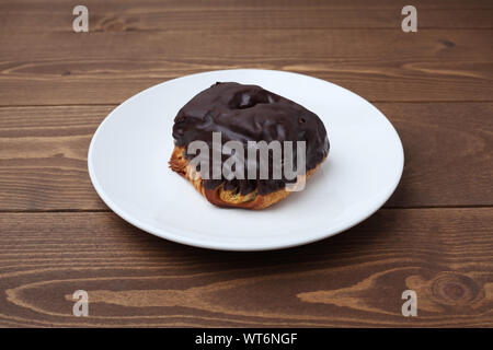 chocolate croissant bread danish on plate isolated on table Stock Photo