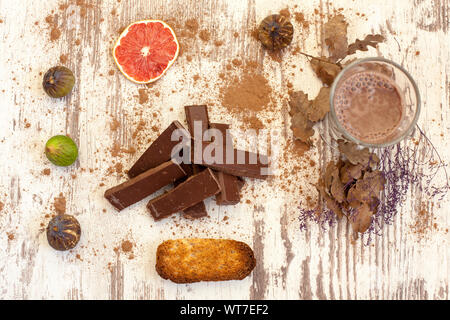 A glass of hot chocolate with fruit decorated on the table Stock Photo