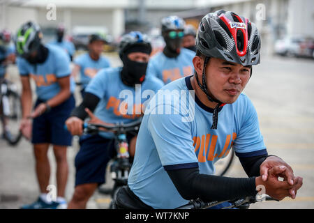 Manila, Philippines. 11th Sep, 2019. Members of the Philippine National Police (PNP) Bike Patrol practice maneuvers with their bicycles in Manila, the Philippines, Sept. 11, 2019. The PNP Bike Patrol will be deployed to tourist spots and areas frequented by tourists after the Department of Tourism (DOT) and the PNP agreed to organize Tourist-Oriented Police for Community Order and Protection program (TOPCOP) nationwide. Credit: Rouelle Umali/Xinhua/Alamy Live News Stock Photo