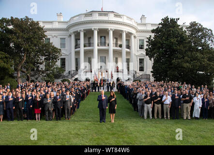 United States President Donald J. Trump and first lady Melania Trump observe a moment of silence at 8:46am EDT in commemoration of the 18th anniversary of the terrorist attacks on the World Trade Center in New York, NY and the Pentagon in Washington, DC on Wednesday, September 11, 2019.Credit: Ron Sachs/CNP /MediaPunch Stock Photo