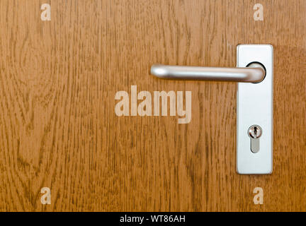 Door handle - Section of a modern internal door with handle and lock Stock Photo