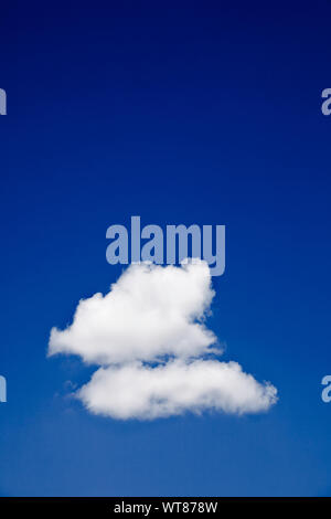Blue sky and solitary clouds Stock Photo