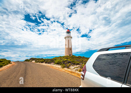 Cape Du Couedic lighthouse under beautiful sky by the road with Stock Photo