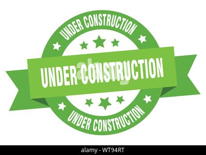 under construction ribbon. under construction round green sign. under construction Stock Vector