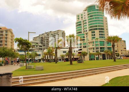 View of the public plaza situated between the Ashford Avenue main road, and the Condado public beach, on the northern coast of Puerto Rico. Stock Photo