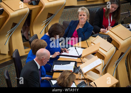 Edinburgh, UK. 5 September 2019. Pictured: (L-R) John Swinney - Depute First Minister; Nicola Sturgeon MSP - First Minister & Leader of the Scottish National Party; Jeane Freeman - Health Minister; Roaseanna Cunningham - Rural & Environment Minister; Aileen Campbell. First Ministers Questions in the chamber takes place after the summer break.  Colin Fisher/CDFIMAGES.COM Stock Photo