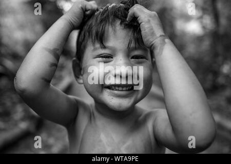 A friendly and happy indigenous boy from the Brazilian Amazon Stock Photo