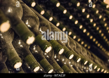 Wine bottles stored in rows Stock Photo