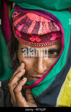 Woman from Aru Valley wearing colorful traditional clothing Stock Photo