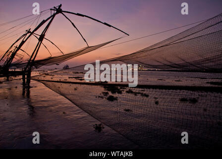 Twilight in the Chinese Fishing Nets of Fort Kochi Stock Photo