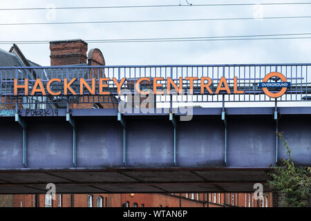 Signage for Hackney Central Overground Station on a railway bridge over Mare Street. London, UK Stock Photo
