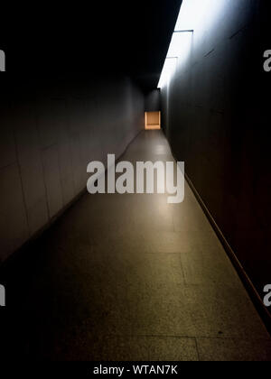 long corridor have light at the end inside buiding get natural light form outside create shade in space design architecture atmosphere Stock Photo