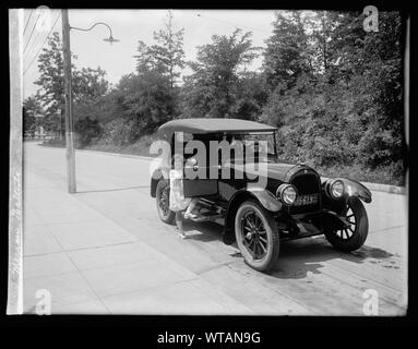 Meriam Battista; Meriam Battista [opening door of automobile]; Stock Photo