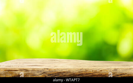 Beautiful texture of old tree stump table top on blur green garden farm background.For create product display or design key visual layout. Stock Photo