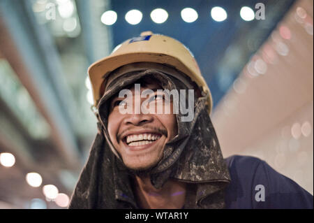 Smiling builder wearing a hardhat Stock Photo