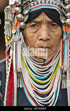 Ethnic Akha people wearing traditional clothes in tribal village near ...