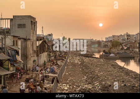 Sunset in a riverside Saigon slum Stock Photo