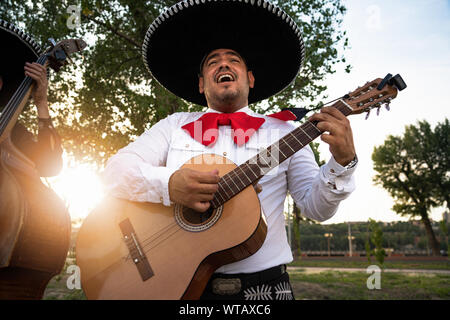 Mexican musicians mariachi playing the guitar Stock Photo