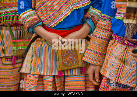 A Hmong group of girls in colorful traditional embroidered dresses Stock Photo