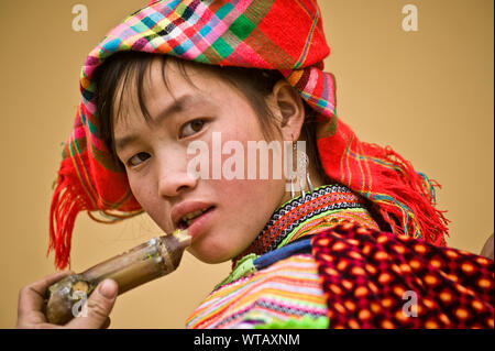 Hmong girl eating sugar cane Stock Photo