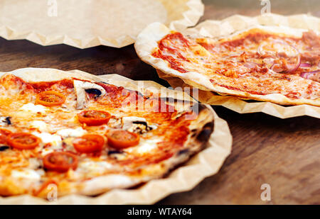 Freshly baked margherita pizza topped with tomato sauce, mozzarella and mushrooms. Typical recipe of Italian cuisine Stock Photo