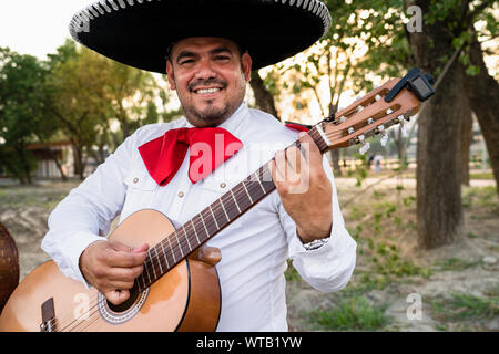 Mexican musicians mariachi playing the guitar Stock Photo