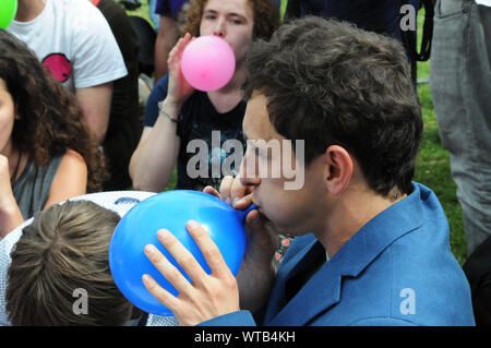 Stephen Reid organiser of Protest Against Criminalization of Legal Highs, gets high on Nitrous oxide also known as laughing gas. Stock Photo