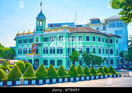 BANGKOK, THAILAND - APRIL 24, 2019: The beautiful green historical store edifice with the tower on the top in the central district nowadays is the Kin Stock Photo