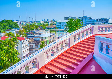 The staircase to the top of the hill to the Wat Saket Temple with a view on historical poor houses, surrounding the shrine, Bangkok, Thailand Stock Photo