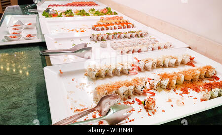 Sushi buffet, Japanese traditional food of Japanese sushi, Tasty and healthy oriental food, Japanese restaurant with sushi buffet. Stock Photo
