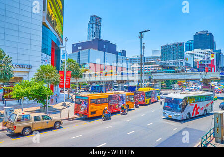 BANGKOK, THAILAND - APRIL 24, 2019: The modern district of the city with numerous shopping malls and hotels stretching along the large Ratchaprarop ro