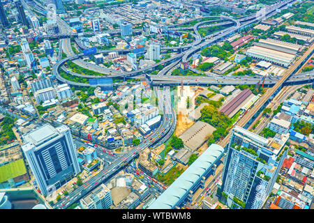 BANGKOK, THAILAND - APRIL 24, 2019: The large highway intersection with multi height roads in the heart of modern city connects various remote distric Stock Photo